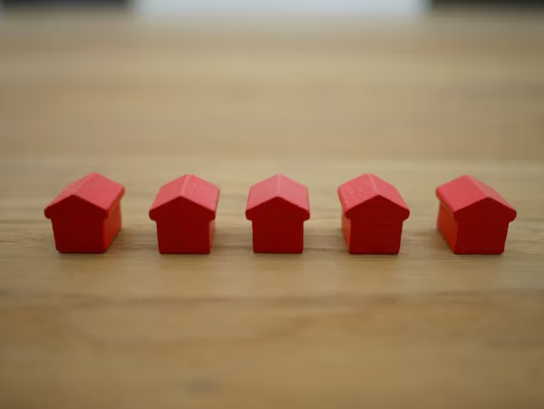 5 red miniature houses 